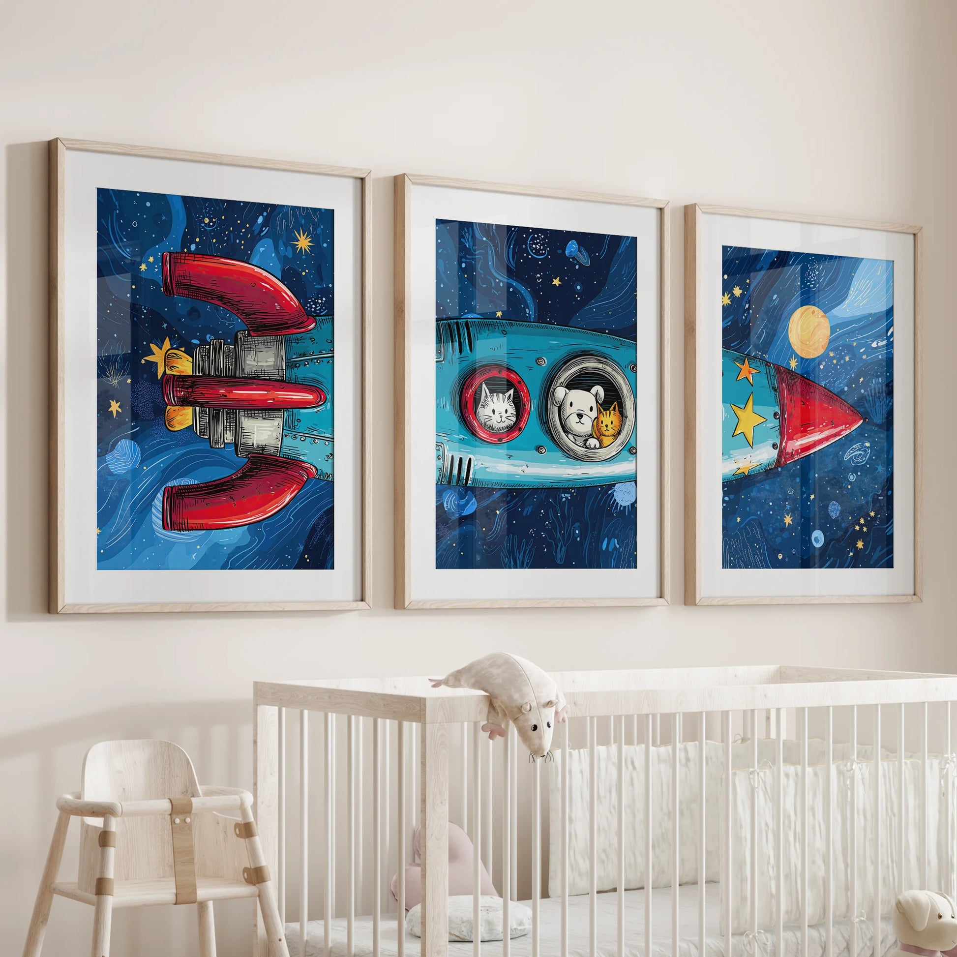 Three cartoon rocket wall pieces in wooden frames with mats cheer the nursery wall above the crib, tidy and kid-friendly.