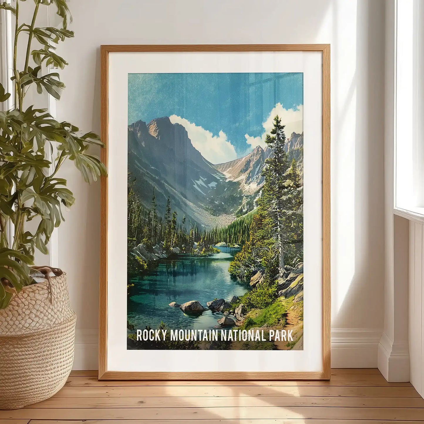 This single travel poster of snow-capped peaks, set in a black-matted frame, leans by the bedroom window for art-studio charm and quiet drama.