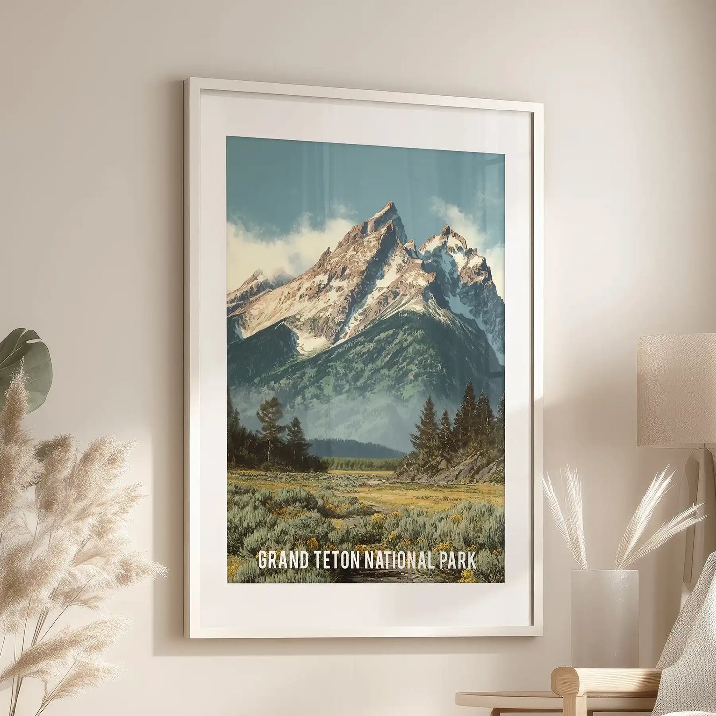 Wyoming national park landscape home wall art, white frame with matting set over a cozy chair in the sitting room, brings trailhead calm and evergreen tones inside.