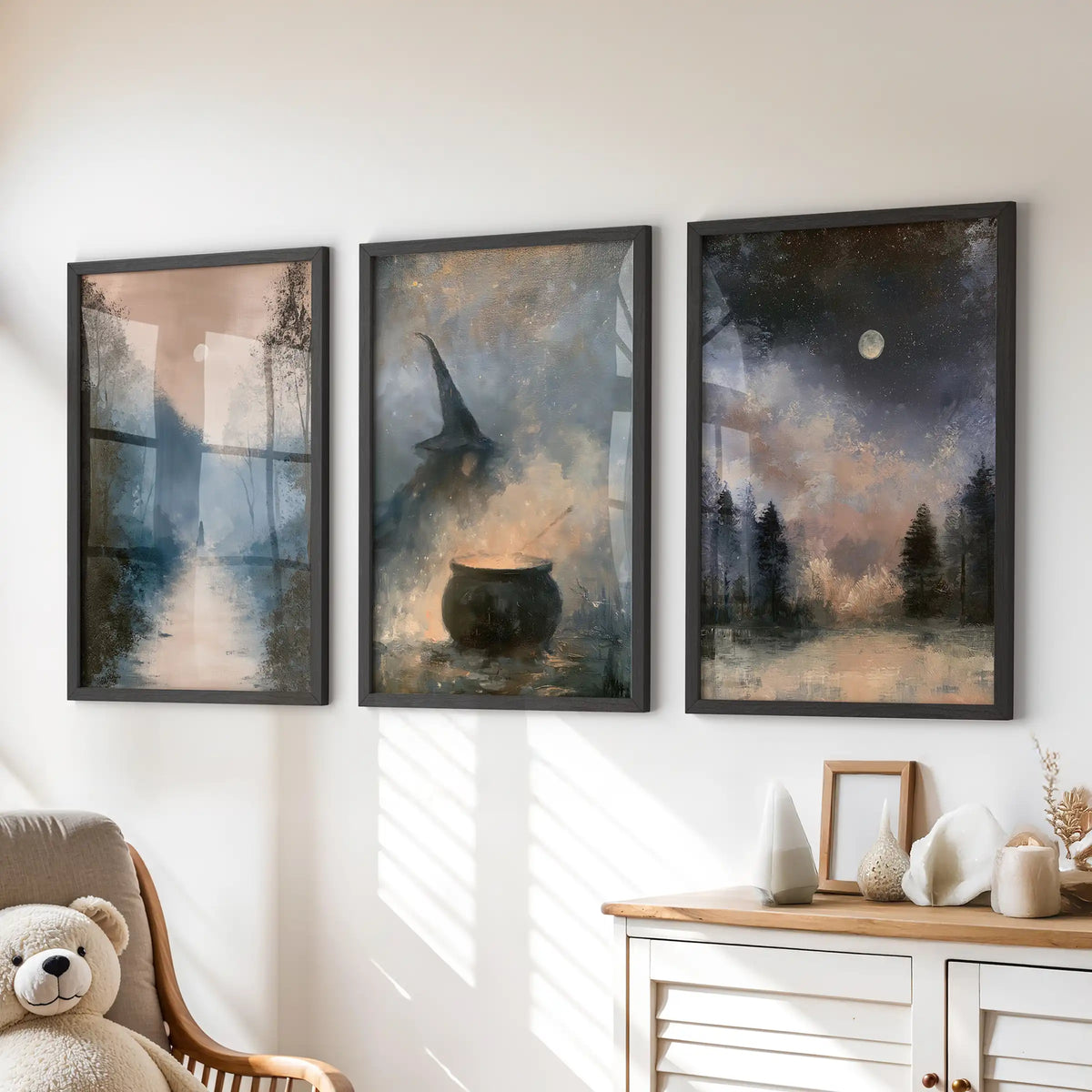 Crescent moon over pines wall art, a three-piece set in black frames, soft and storybook for a kids room, arranged above the dresser.