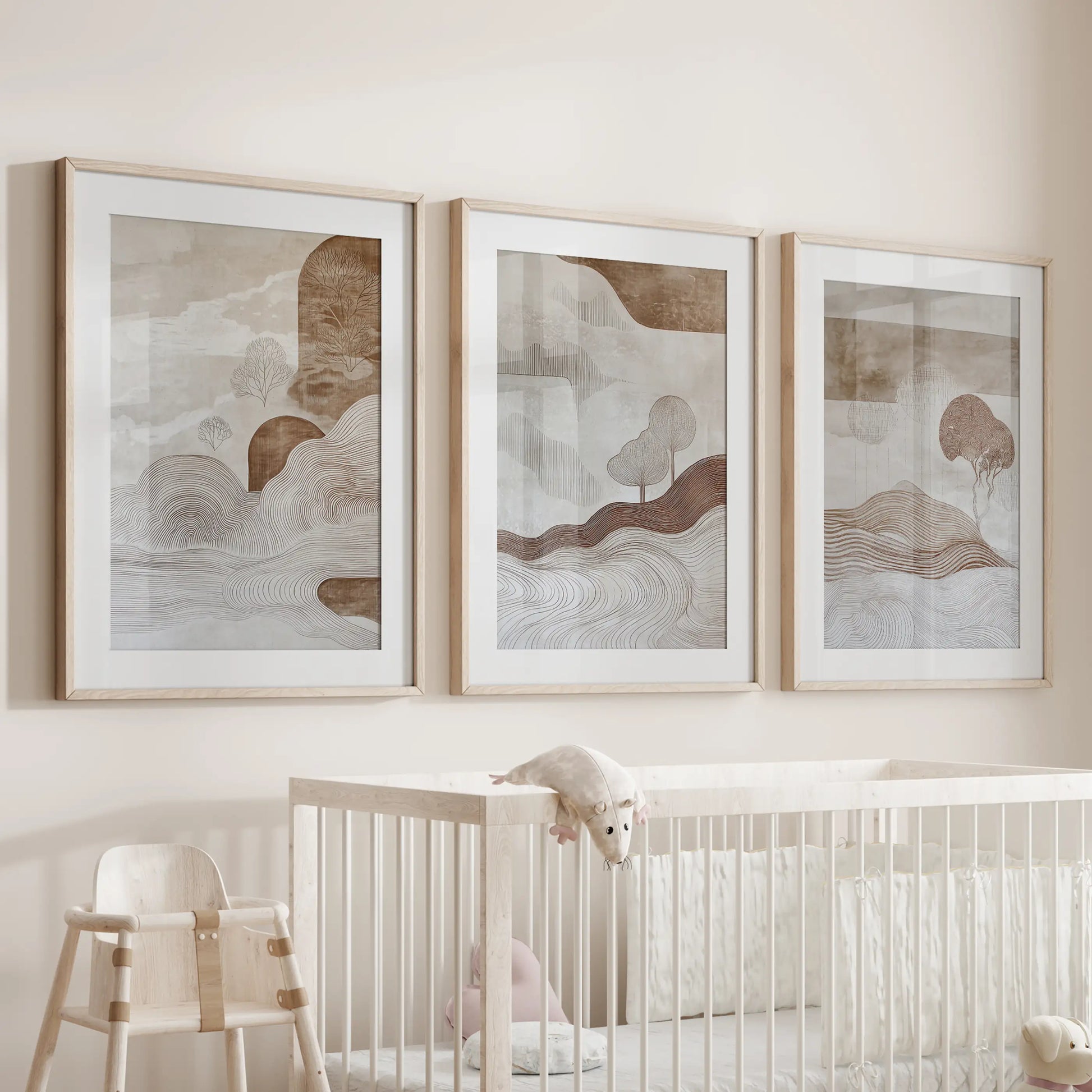 Organic forms in warm neutrals wall art trio set, in wood frames with mats, softens the infant room above the cot with gentle, earthy texture.