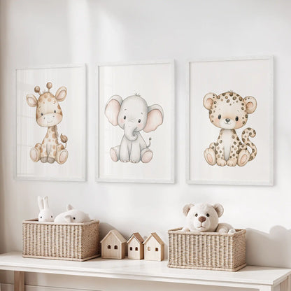 Baby safari animal prints in white frames, a set of three above a toy storage bench.