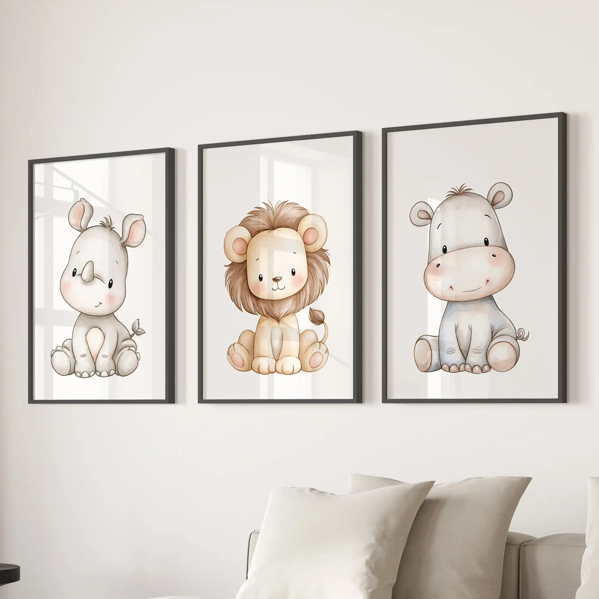 Black frames hold a set of three baby rhino, lion and hippo prints above a sofa.