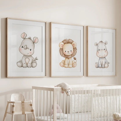 Above a crib, three prints in oak frames with white mats show a pale rhino and gray hippo beside a small lion.