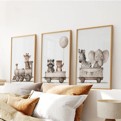 Above a bed, three oak-framed prints show a giraffe-led train of baby animals.
