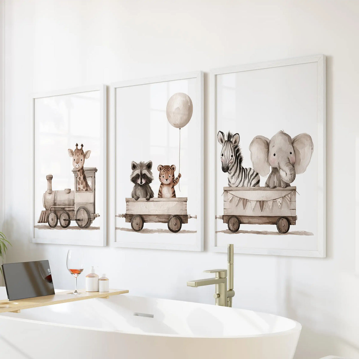Baby animals occupy a wooden toy train across three white-framed prints above a bathtub, with a balloon over the middle car.