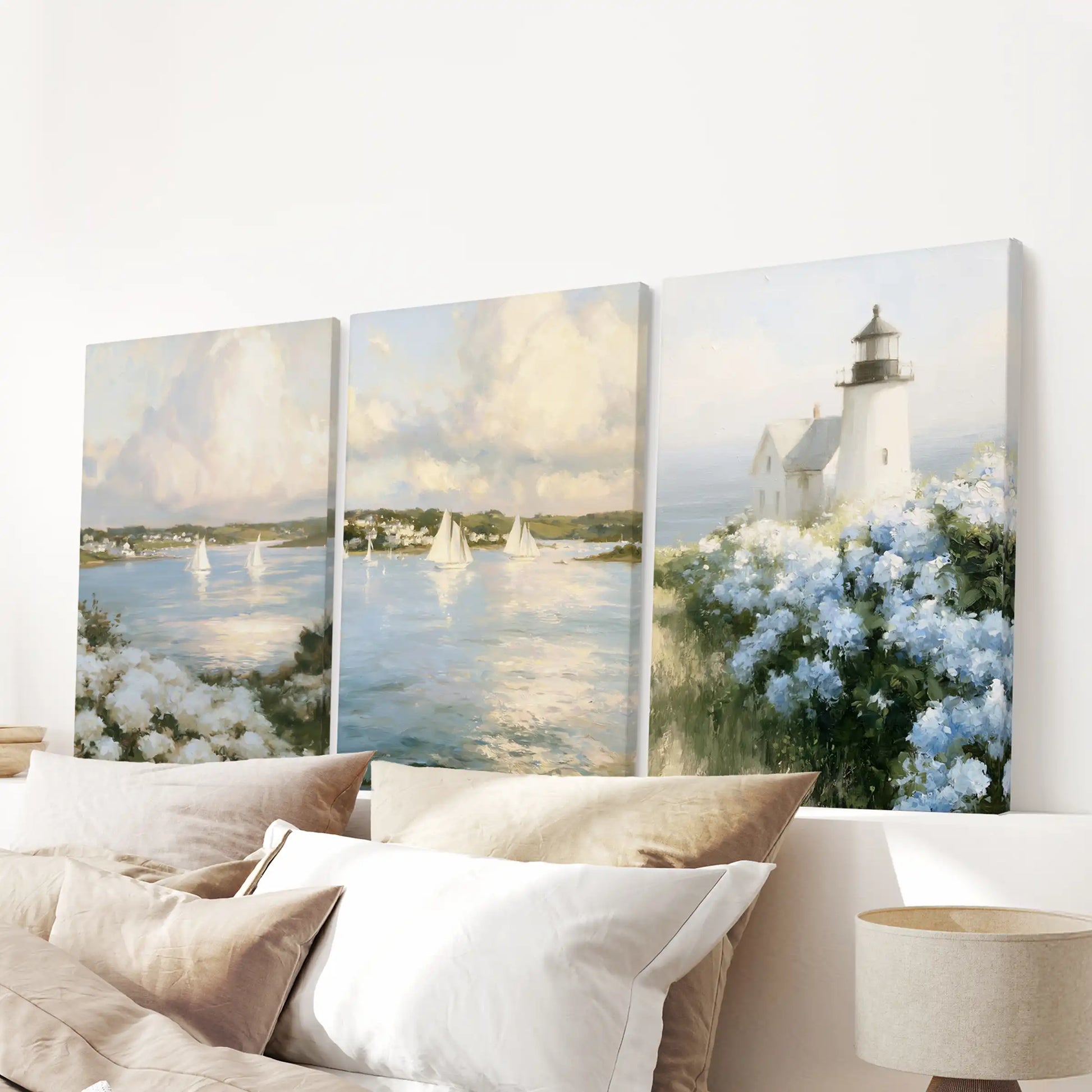 Wall art canvas prints feature a Cape Cod lighthouse in a set of three, creating a timeless nautical focal point centered above the bedroom bed.