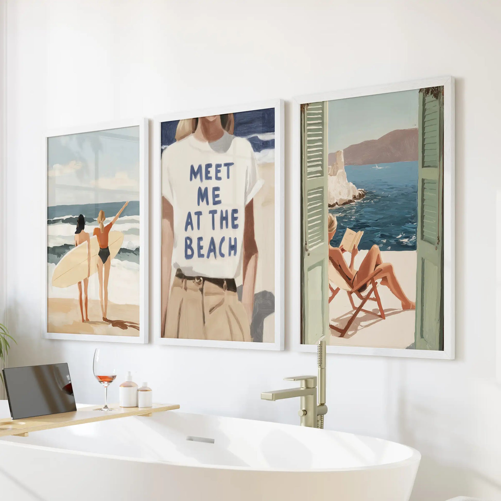 Set above the bathtub, three white-framed wall prints of a surf girl on the beach lend the bathroom a light, spa-calm coastal note.