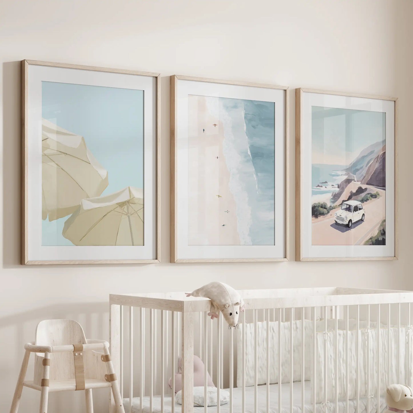 Beach umbrellas wall decor, a trio with wooden frames and mats, creates a gentle coastal focal point above the crib in the infant room.
