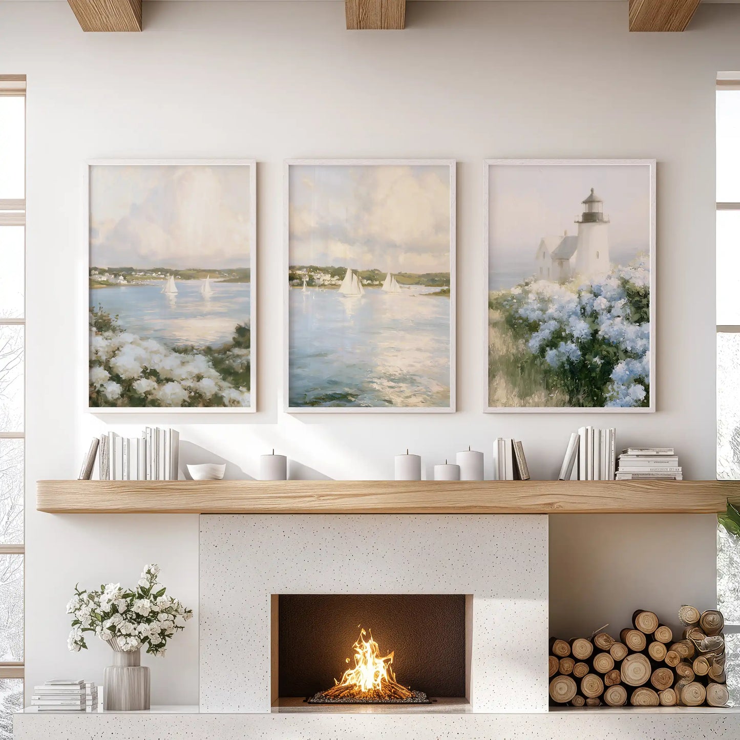 Nantucket sailboats gallery wall of three prints, framed in white, adds airy shoreline energy to the living room over the mantel.