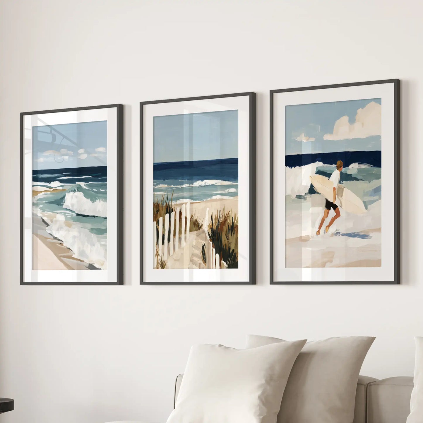 Surfer art prints, set of three, bring coastal energy to the living room in black matted frames, lined up as a clean statement over the couch.