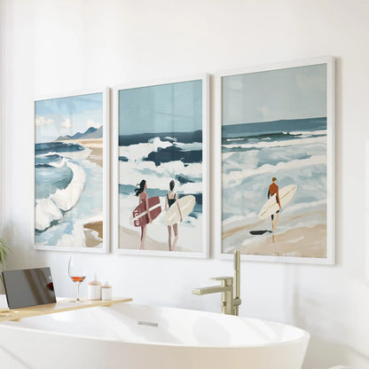 Breaking wave detail three-print set in white frames, arranged over the tub wall to bring spa-like ease to a modern bathroom.