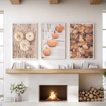 Farmhouse autumn pumpkins triptych wall hanging in white frames sits over the mantel in the lounge, a clean, cozy focal point for the season.