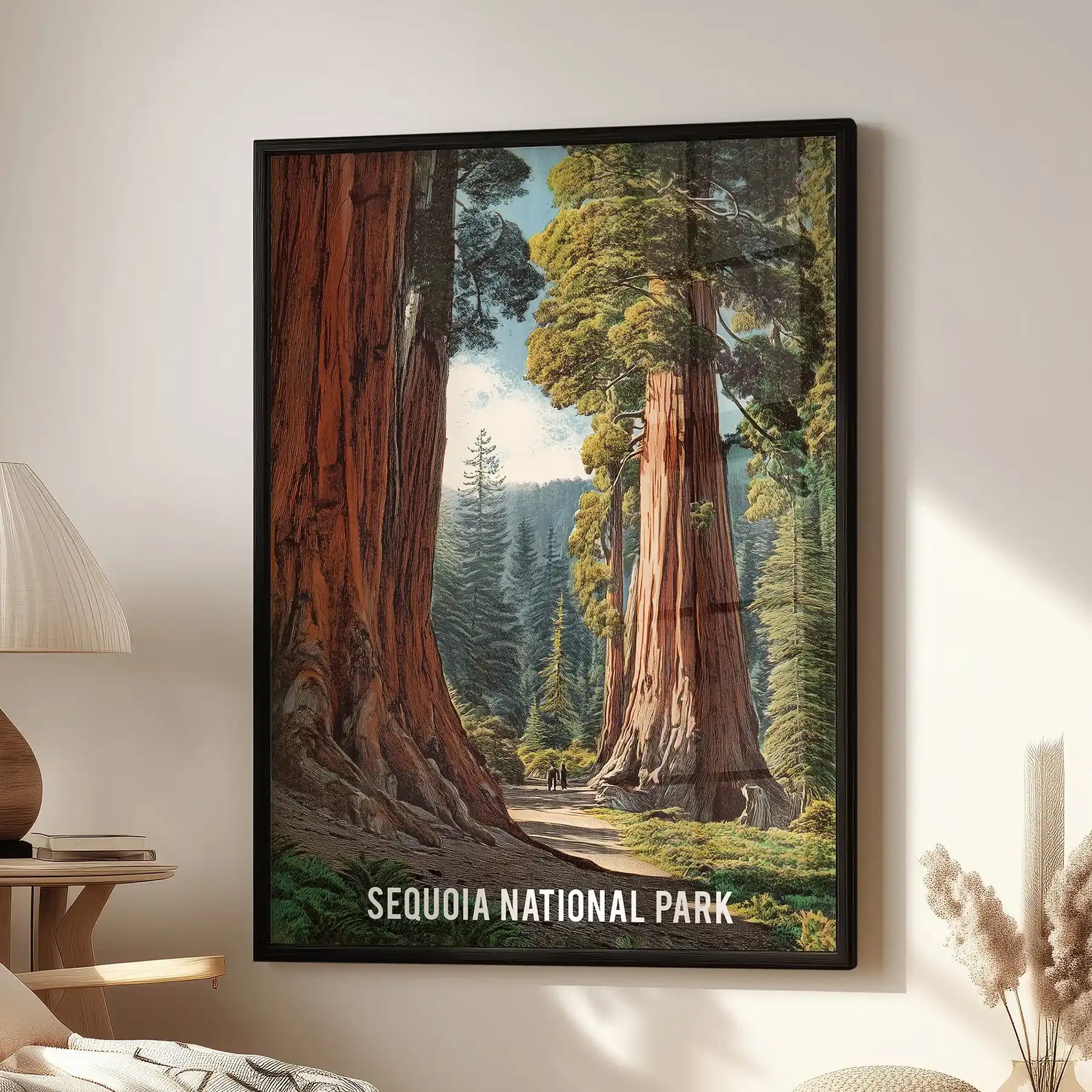 Large wall poster of giant sequoia trees framed in black hangs above a lounge chair, filling the room with towering California greens.