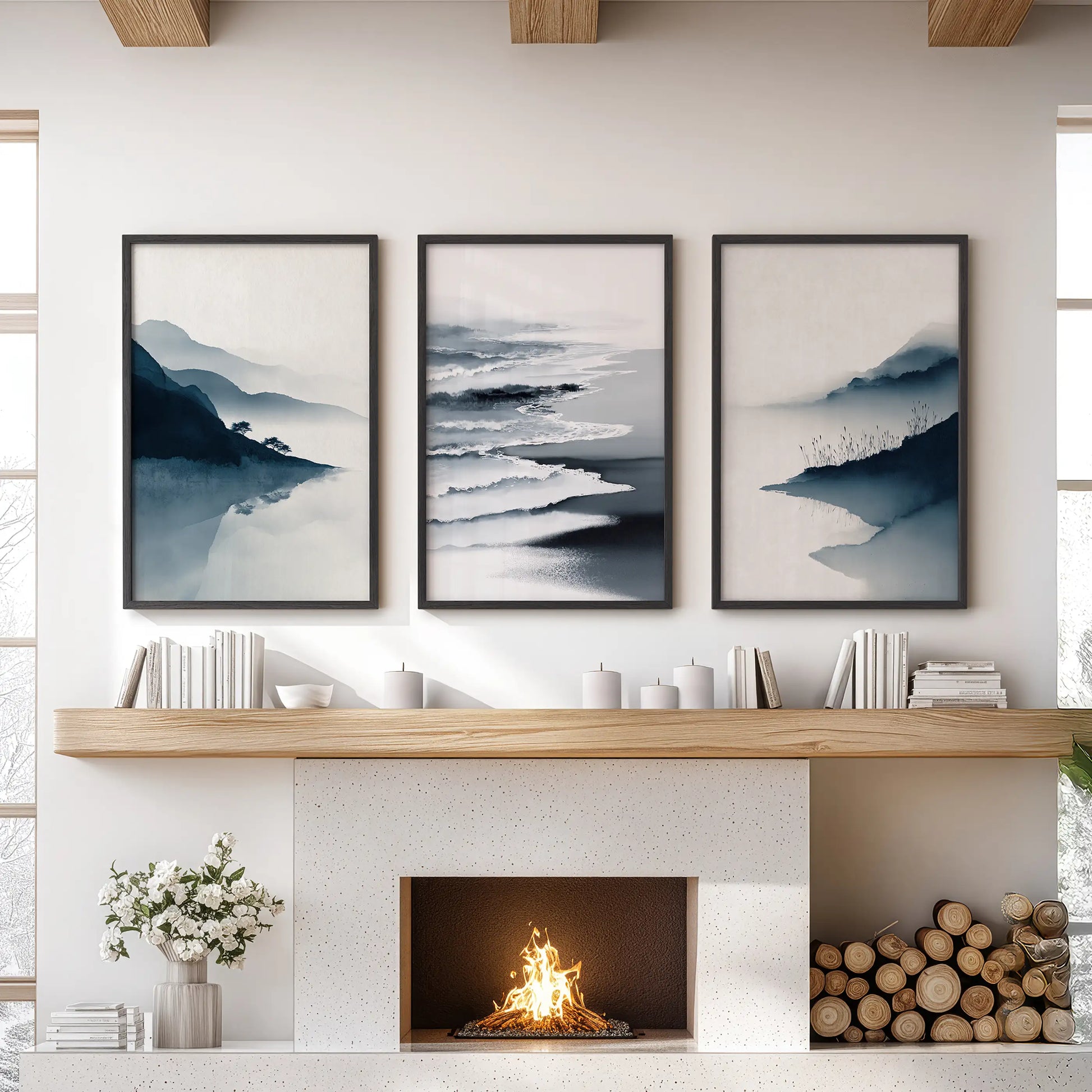 Three black-framed coastal prints form a blue shoreline trio above the sitting-room fireplace, giving the wall a calm seaside focus.