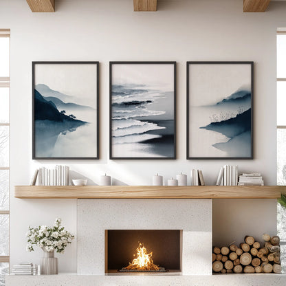 Three black-framed coastal prints form a blue shoreline trio above the sitting-room fireplace, giving the wall a calm seaside focus.