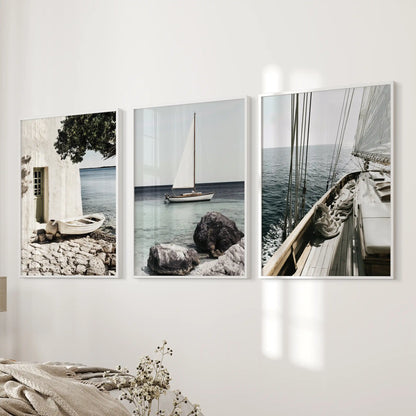 Riviera coastline posters, set of 3, come in white frames and grace the wall next to the bed, adding a tranquil coastal note to the bedroom.