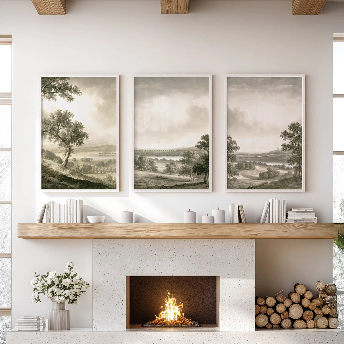 Countryside scenery wall art in three white frames, displayed above the hearth in a living room.