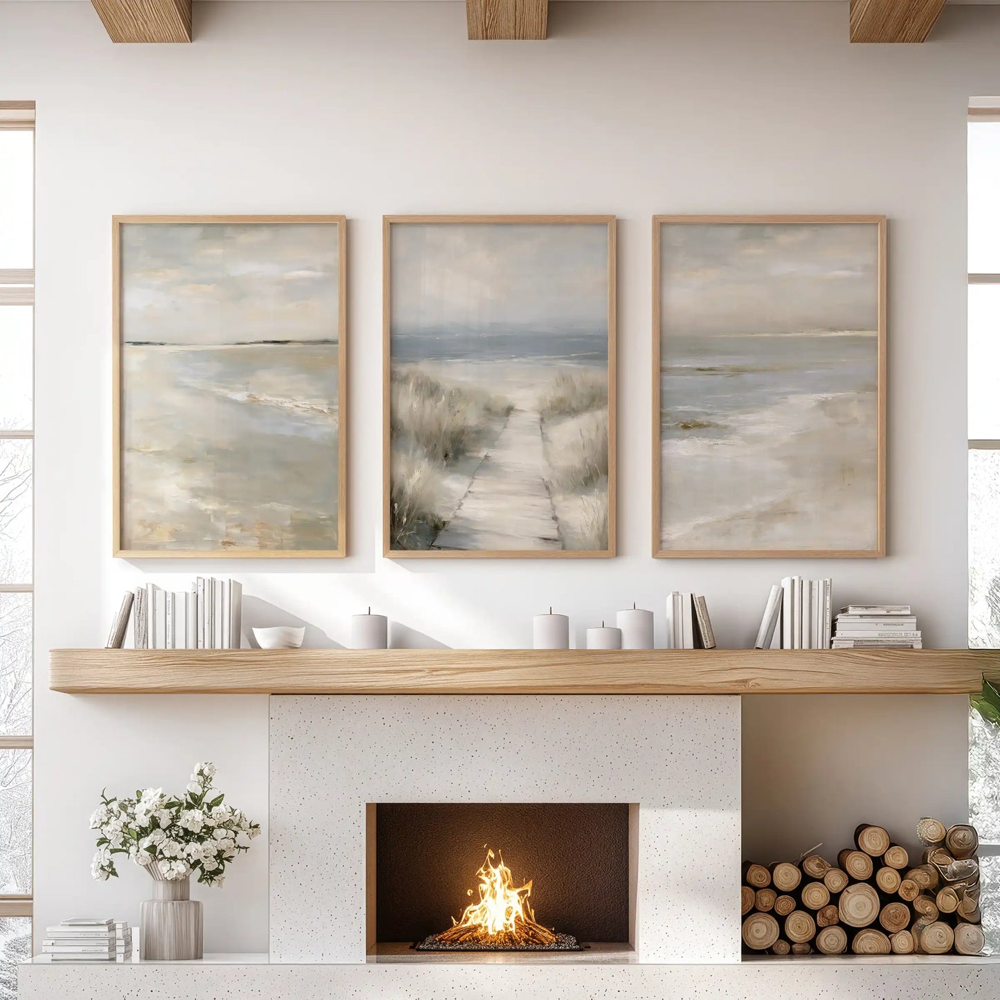 Oak-framed wall art in three panels captures dune grass shorelines and warms the living room wall above the fireplace.