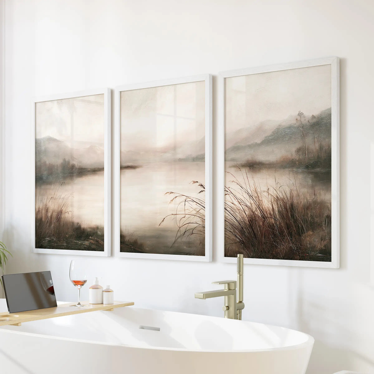 Rustic countryside set of 3 wall art prints in white frames, arranged on a bathroom wall above a freestanding bathtub.