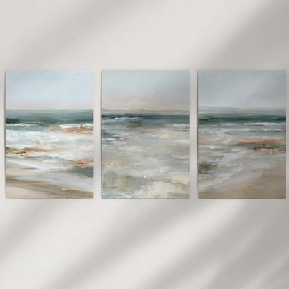Misty ocean view set of three prints arrives as unframed wall art on a white wall, letting soft blues and the horizon feel light and clean.