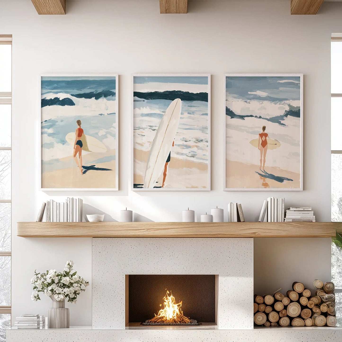 A print set of three Hamptons shoreline scenes in white frames warms the living room above the hearth with soft coastal light.