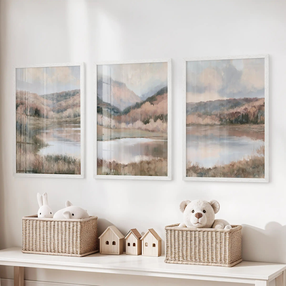 Moody hills above a calm lake, a trio of white-framed prints, sits over the toy organizer in the children’s room and brings a peaceful landscape note.
