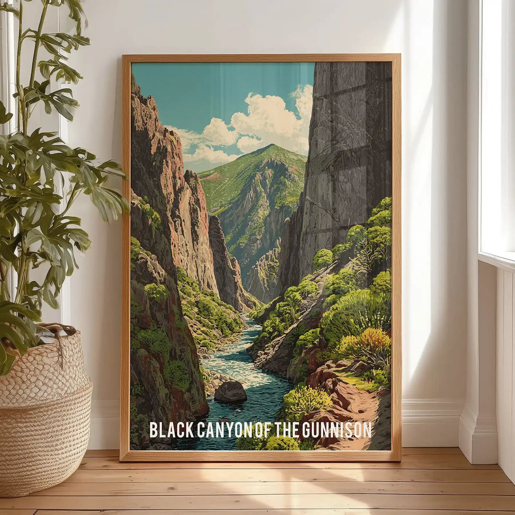 A thin wood-framed picture print of sheer canyon cliffs leans on the bedroom floor, adding rugged texture without crowding the space.