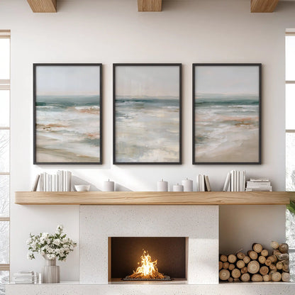 Soft blue seascape wall art set of three in black frames rests over the fireplace, giving the living room a calm, coastal focal point.