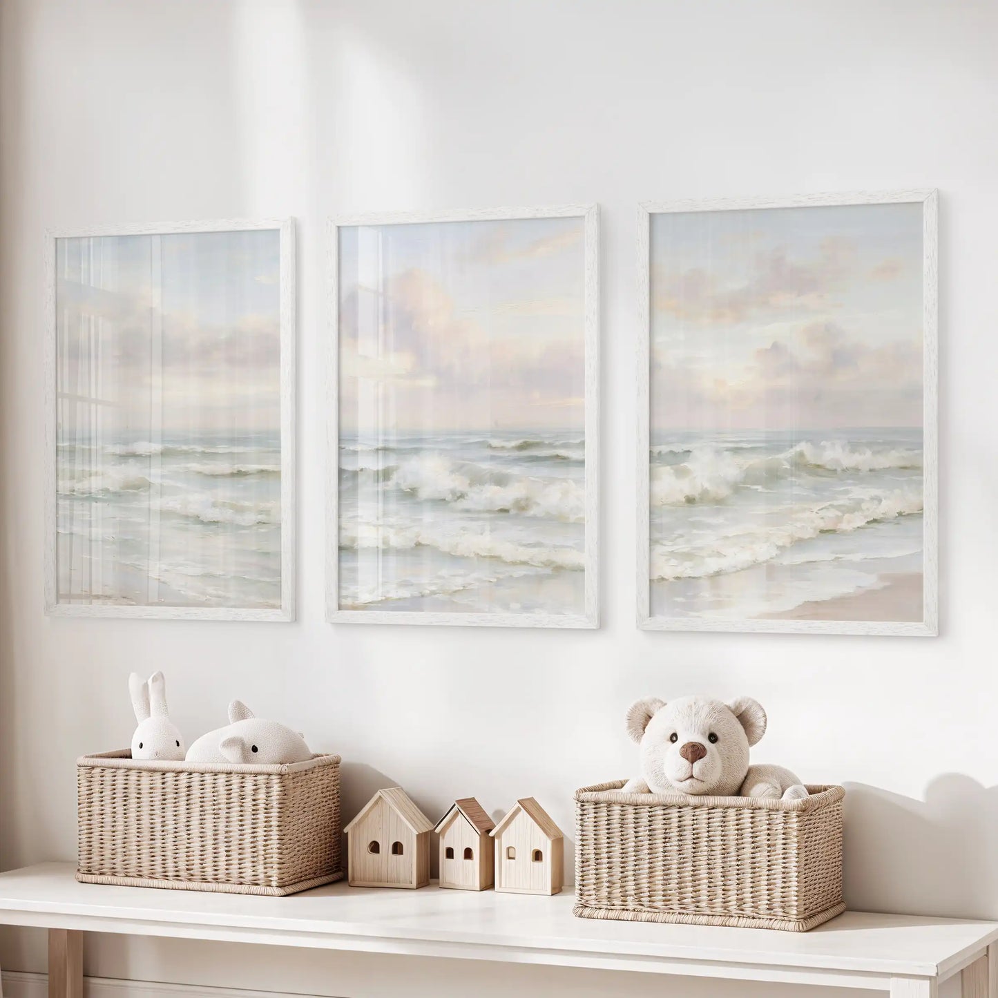 White-framed posters of soft ocean waves, grouped as a 3-piece wall trio, give the playroom a breezy coastal lift above the toy organizer.