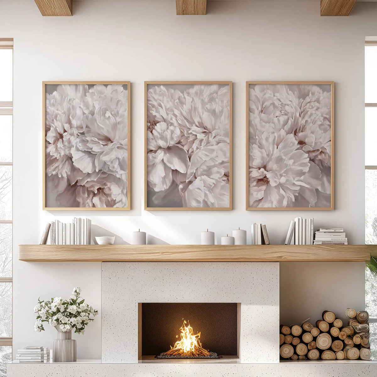 Ruffled blush and ivory petals overlap throughout three oak-framed prints above a fireplace, with soft taupe shadows in the folds.