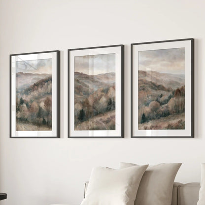 Soft watercolor woods art prints in a set of three hang over the family room sectional, matted in black frames for a serene, cohesive look.