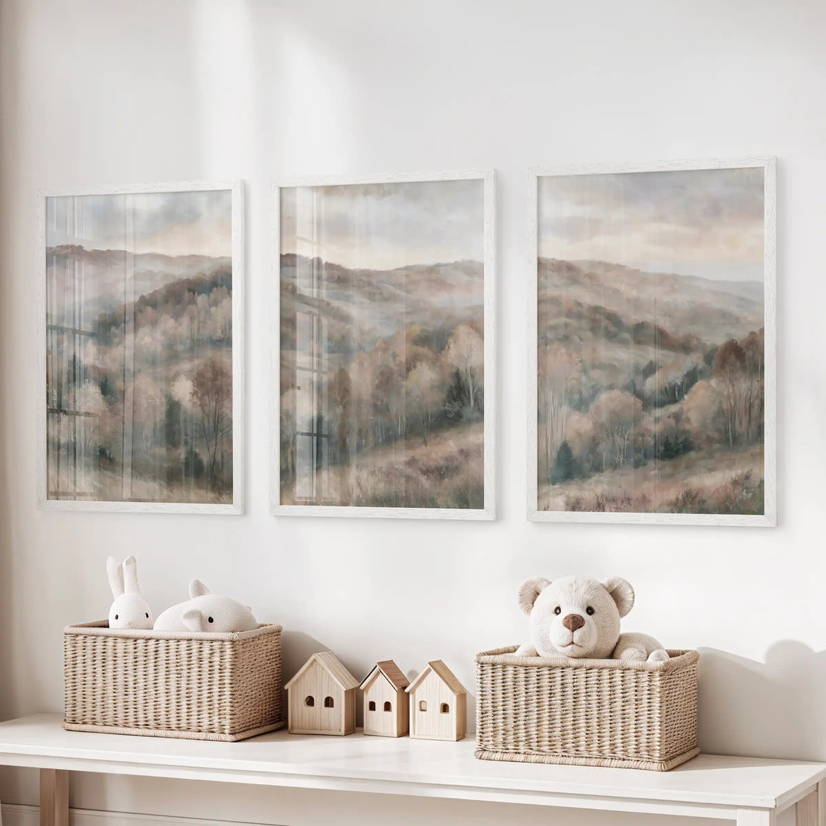 Neutral nature scenery art prints, a three-poster set, hang above the toy organizer in the kids' room, finished in simple white frames.