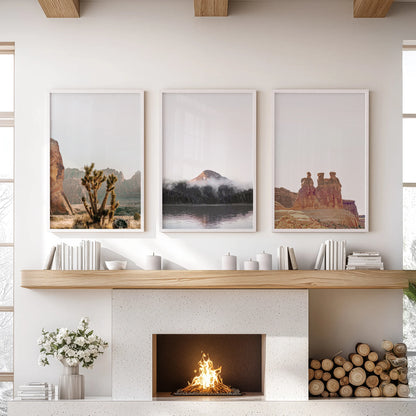 Southwest desert landscape set of 3 wall artworks in white frames anchors the living room, neatly arranged over the mantel.