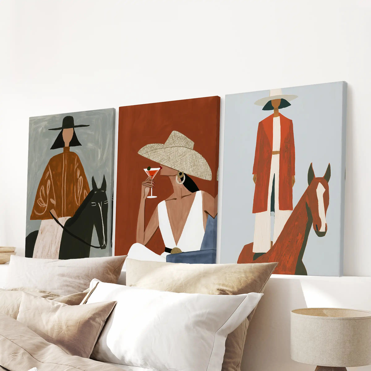 Cowgirl portraits, a gallery-wrapped canvas trio, spans the bedroom above the bed headboard for a clean, modern western focal point.