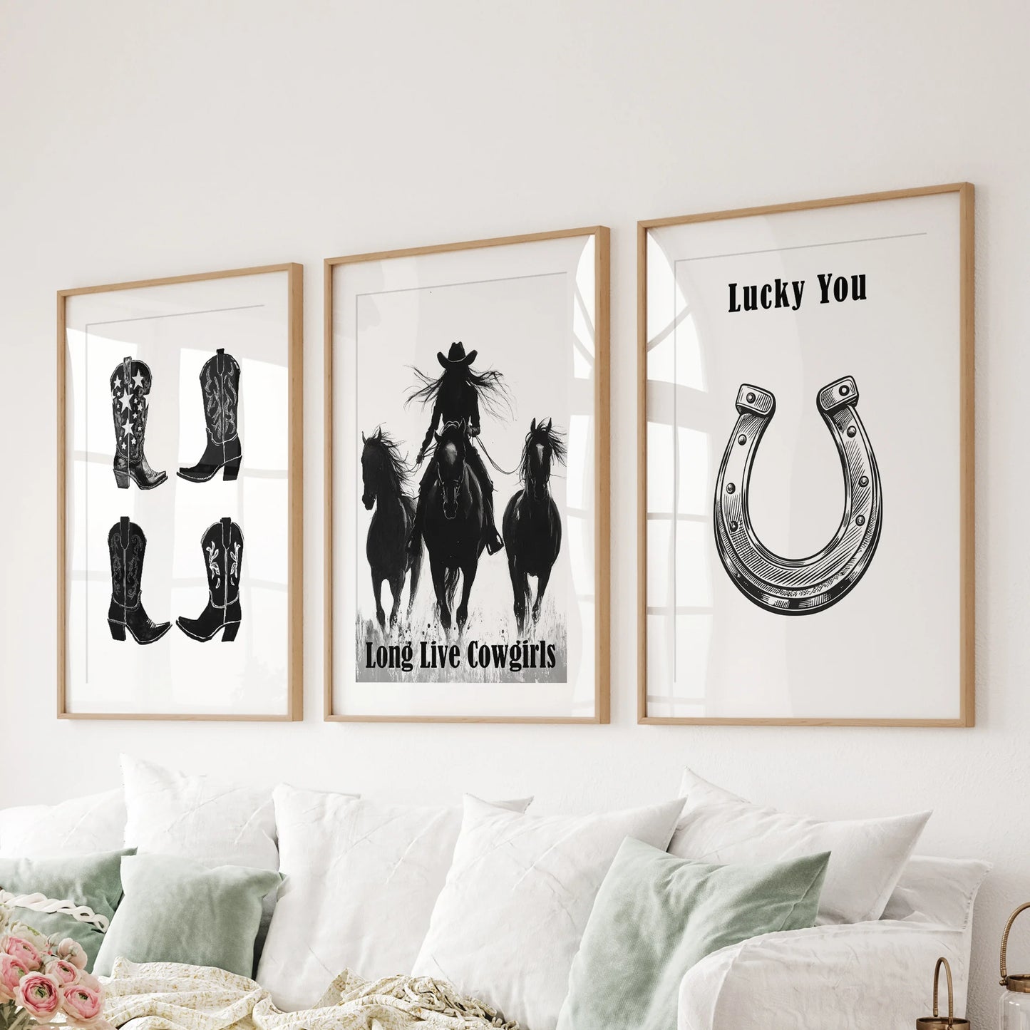 A bold trio of “Long Live Cowgirls” canvas art spreads across the headboard, textured edges making a tactile Western feature wall.