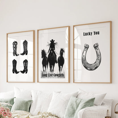 A bold trio of “Long Live Cowgirls” canvas art spreads across the headboard, textured edges making a tactile Western feature wall.