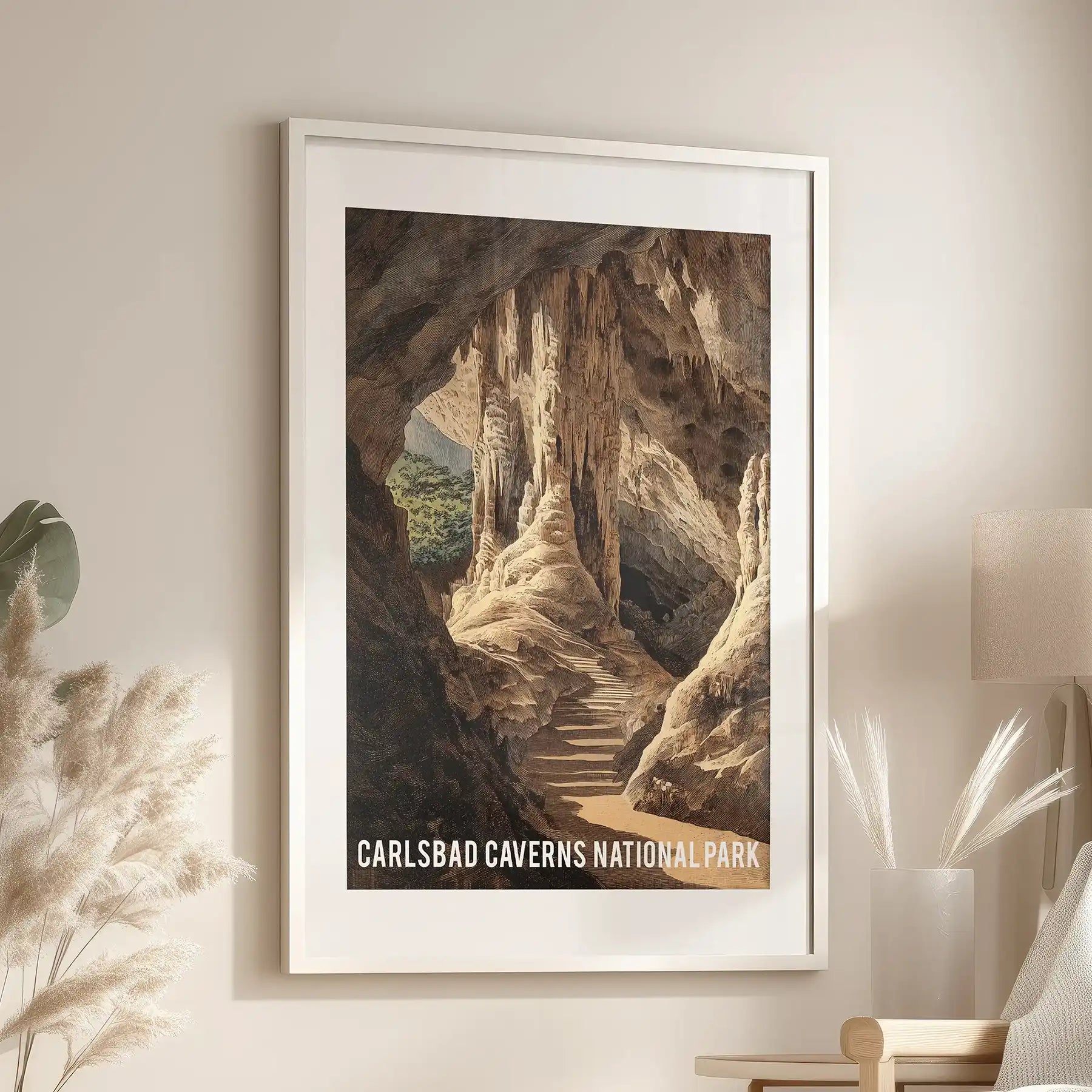 White-framed wall art with a wide mat hangs above the sitting-room armchair, its underground scene reflecting the warm tones and depth of limestone.
