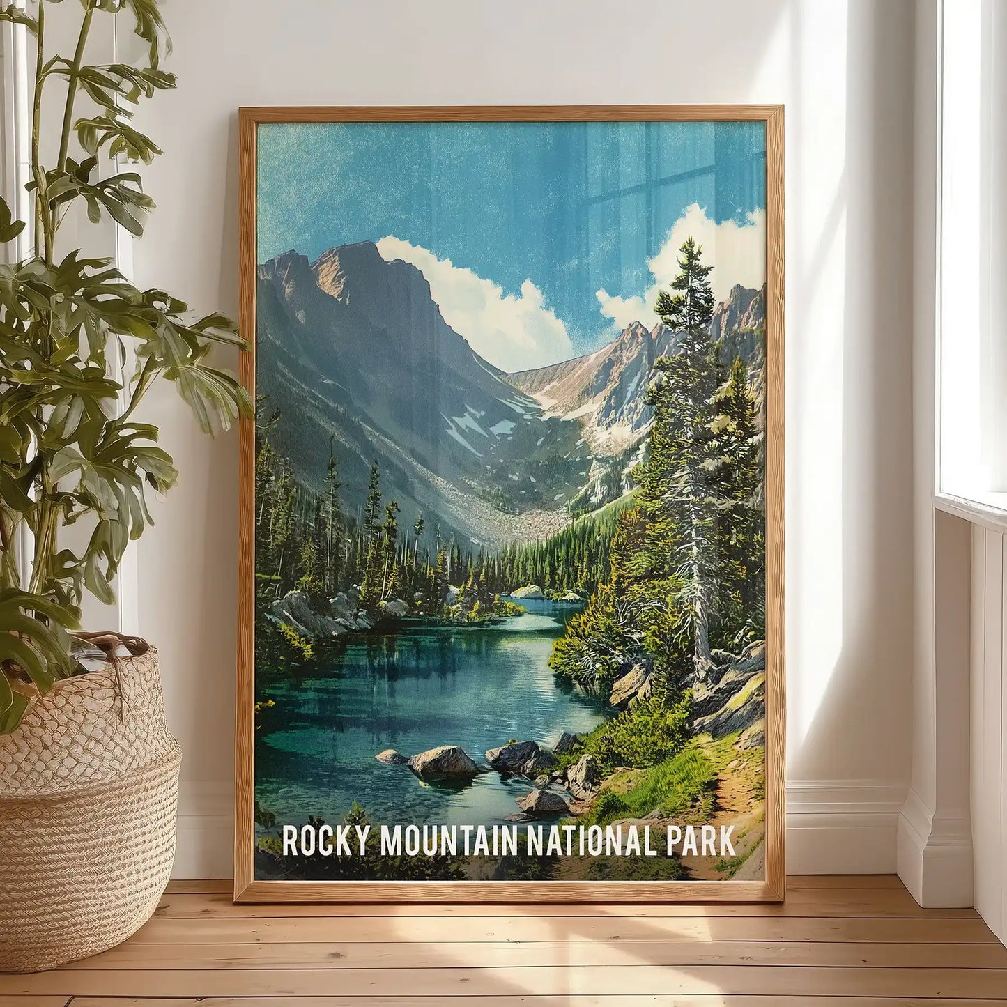 Colorado mountain range vista gallery wall print in an oak frame, propped on the bedroom floor against the wall for an easy, relaxed display.