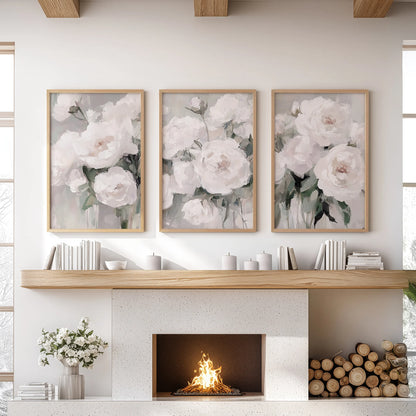 In light-wood frames, three floral prints brighten the mantel wall, their sunlit petals adding warmth and organic texture to the living room.
