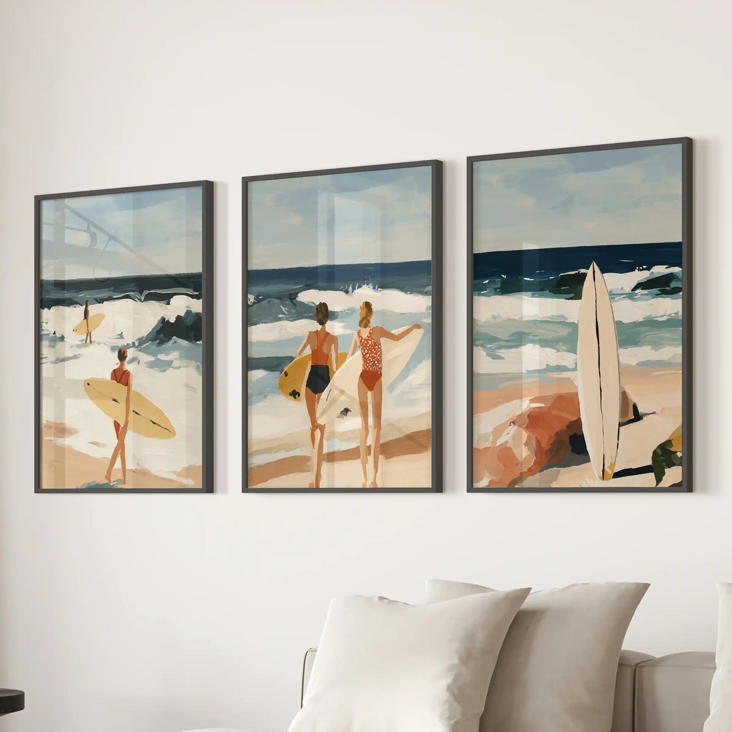 Black-framed beach scene prints, a set of three, rest above the sectional in the living room and evoke an easy, sun-washed coastal tone.