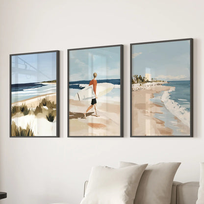A three-piece seaside wall art set in sleek black frames centers the sitting room over the sectional with airy blue calm.
