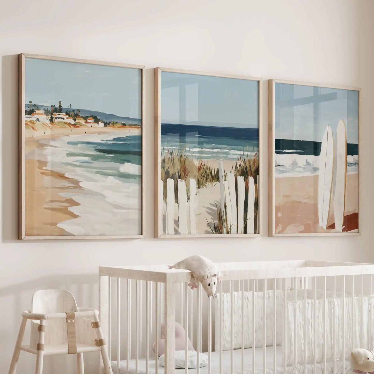 Coastal seascape oak-framed prints float above the bassinet in the nursery, a gentle set of three that keeps the room feeling bright and breezy.
