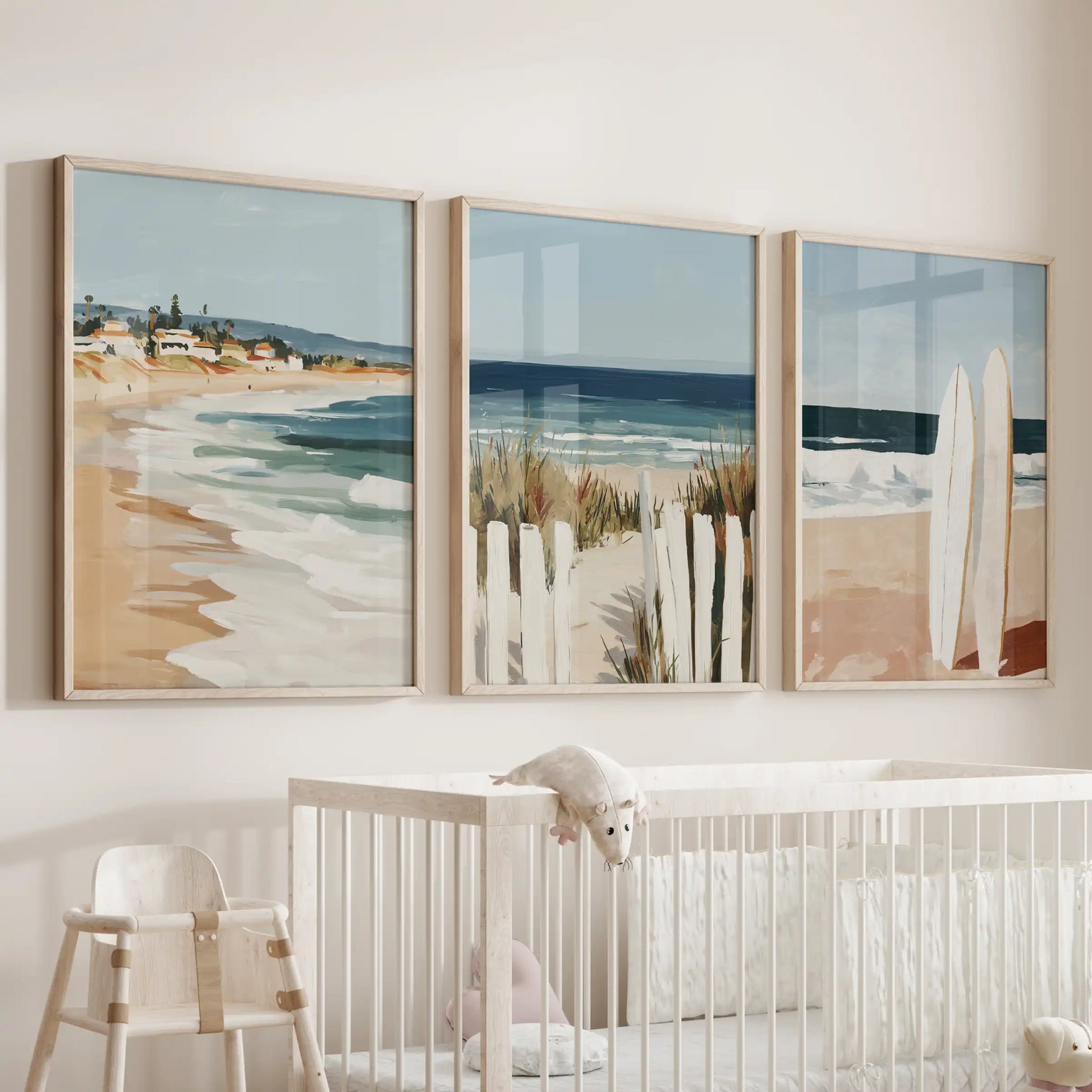 Coastal seascape oak-framed prints float above the bassinet in the nursery, a gentle set of three that keeps the room feeling bright and breezy.