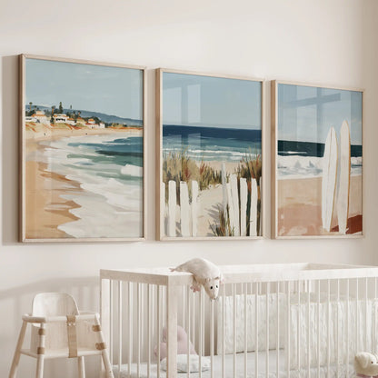 Coastal seascape oak-framed prints float above the bassinet in the nursery, a gentle set of three that keeps the room feeling bright and breezy.