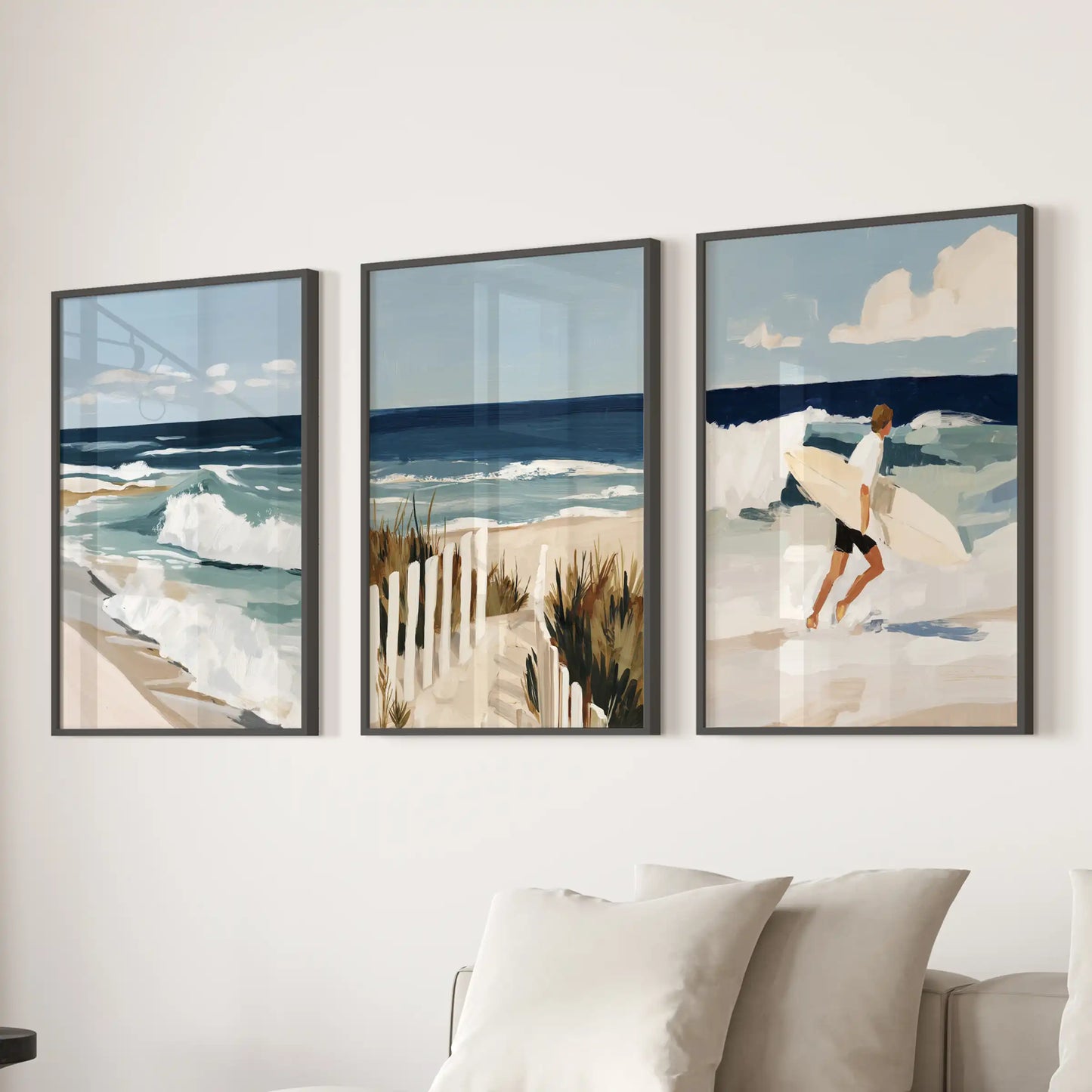 Sandy beach path print trio set, in black frames, gives the living room an airy stride, hanging wide over the sectional sofa.
