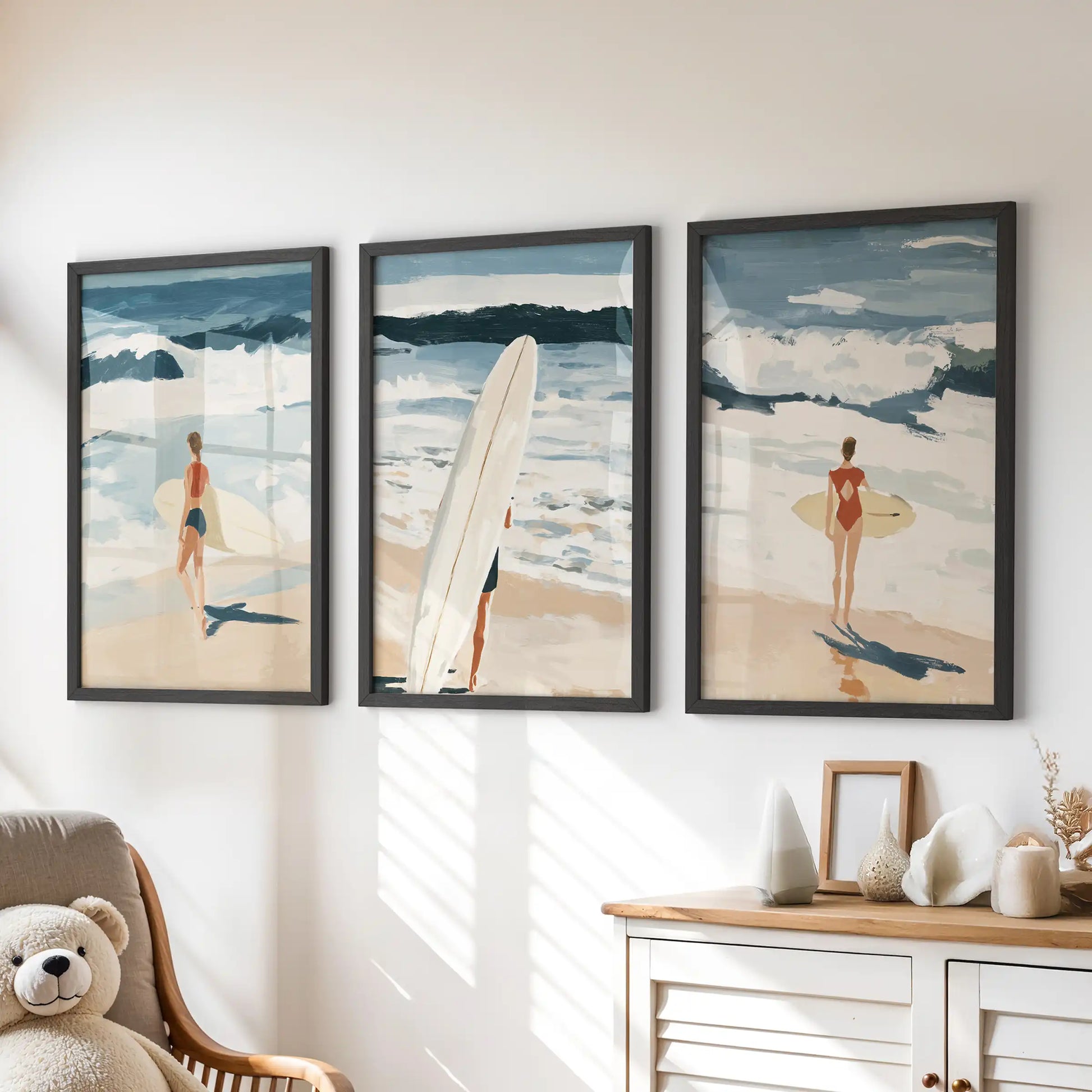 Surfboards by the sea, a poster trio in black frames, perks up the children's room above the dresser with sunny surf style.