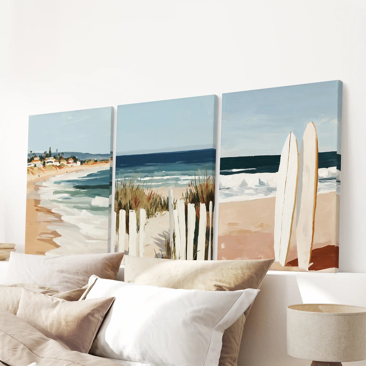 Ocean landscape three-piece wall hanging on stretched canvases sits neatly over the headboard, finishing the bedroom with a salt-air horizon.