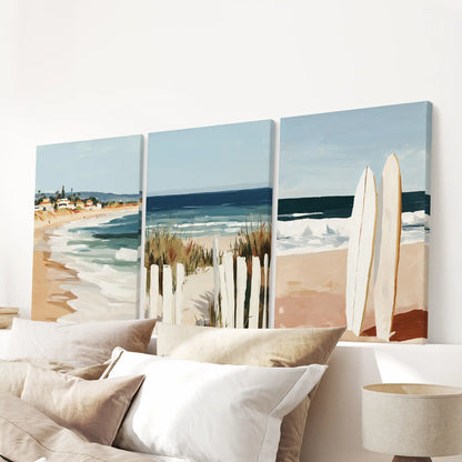 Ocean landscape three-piece wall hanging on stretched canvases sits neatly over the headboard, finishing the bedroom with a salt-air horizon.