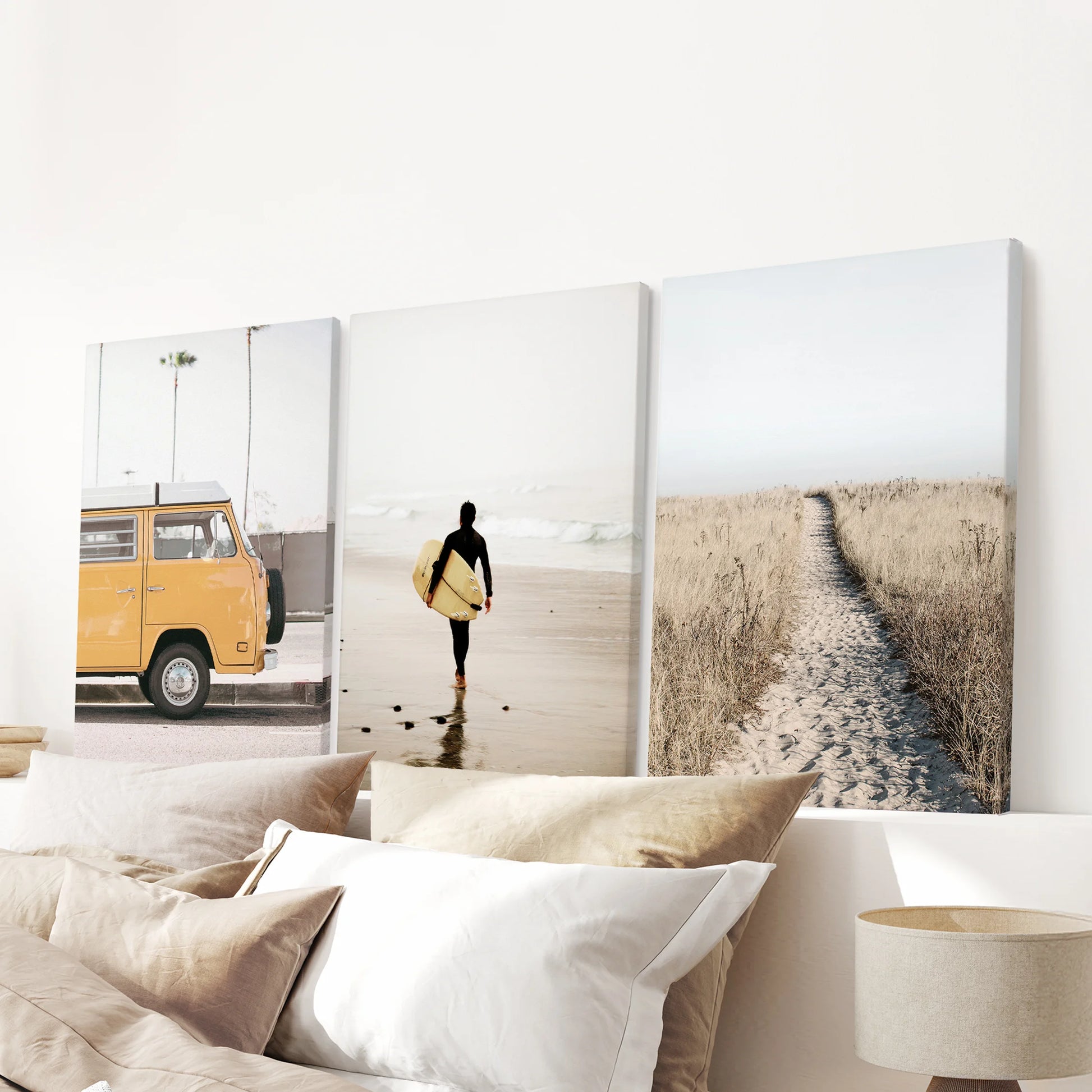 Unframed canvas set of three surfer-wave posters hangs over the bed, keeping the bedroom look crisp, textured, and relaxed.